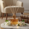 Georgia Rose Jasmine Reed Diffuser in amber glass bottle with jasmine flowers